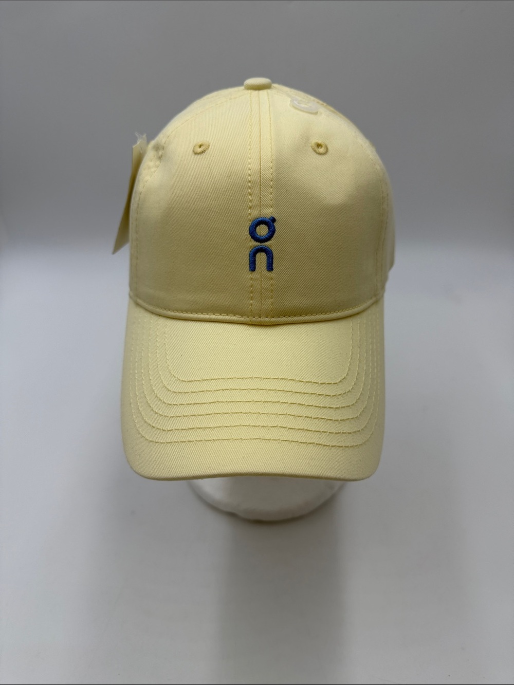 On Running  Pale Yellow Baseball Cap with Blue Logo